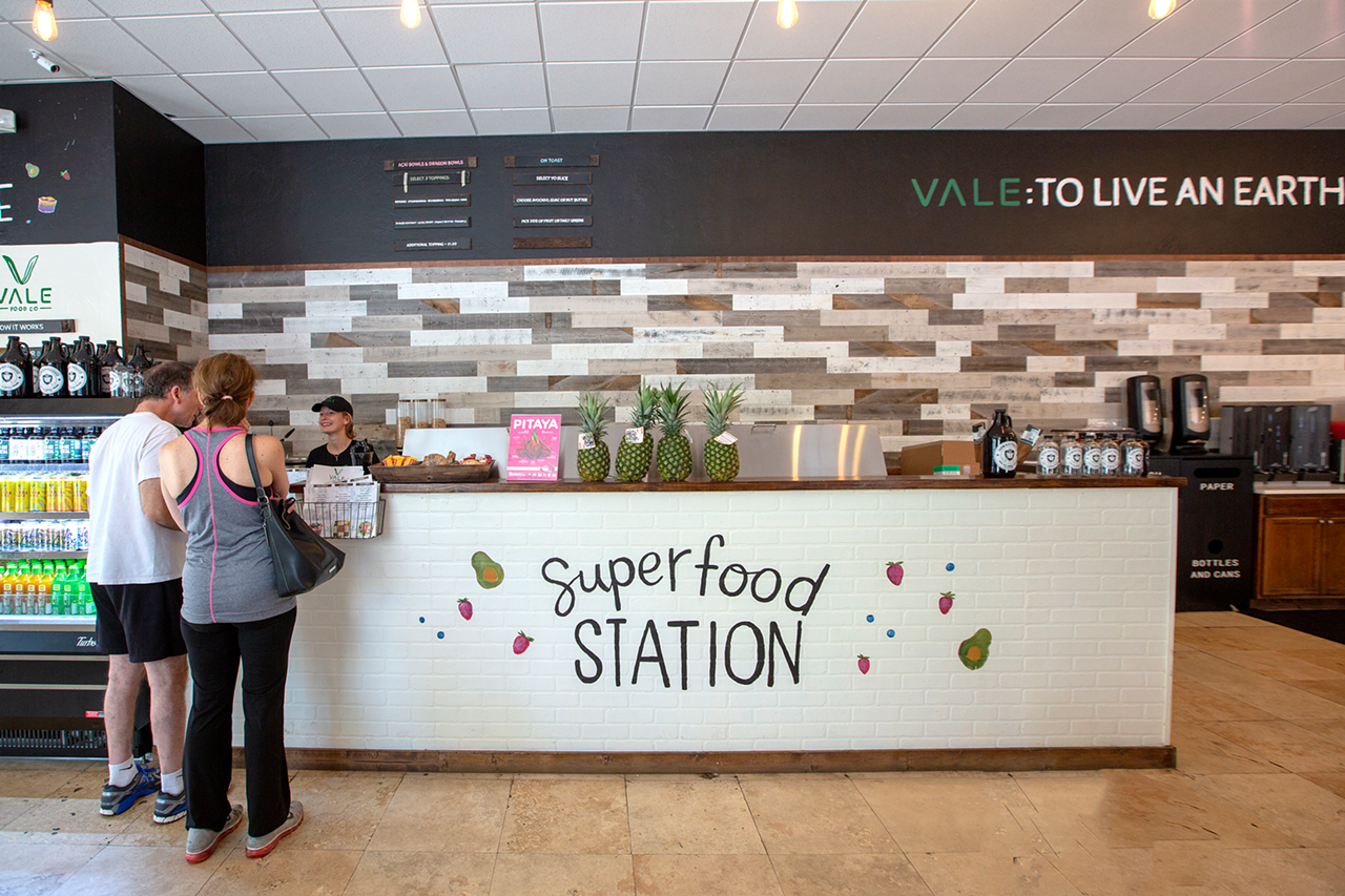 The "Superfood Station," or cold bar, is where customers order acai and poke bowls.