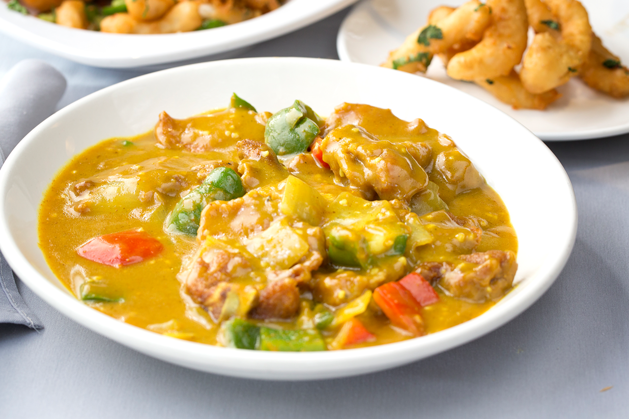 Presented in curry sauce, stir-fried pork chops mingle with onion and green peppers.