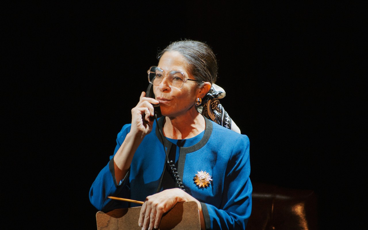 Michelle Azar, wearing Devon Renee Spencer's wardrobe, which captures Justice Ruth Bader Ginsburg's style from flowing robes, to a royal blue power suit.