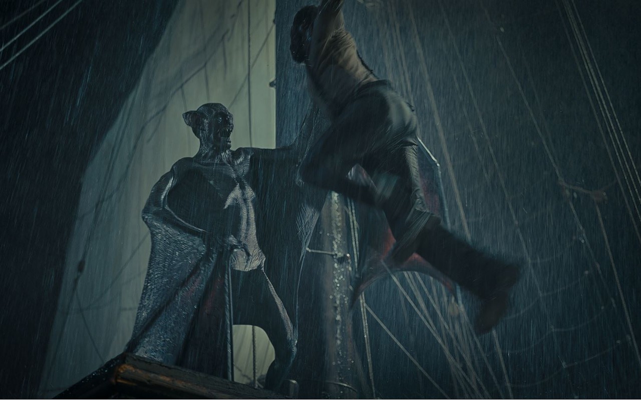 Dracula (Javier Botet), left, prepares to make a nighttime snack out of a poor deckhand on the Demeter.