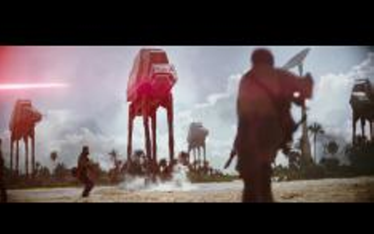 A ground-level view as AT-AT Walkers attack during the climactic battle in Rogue One.