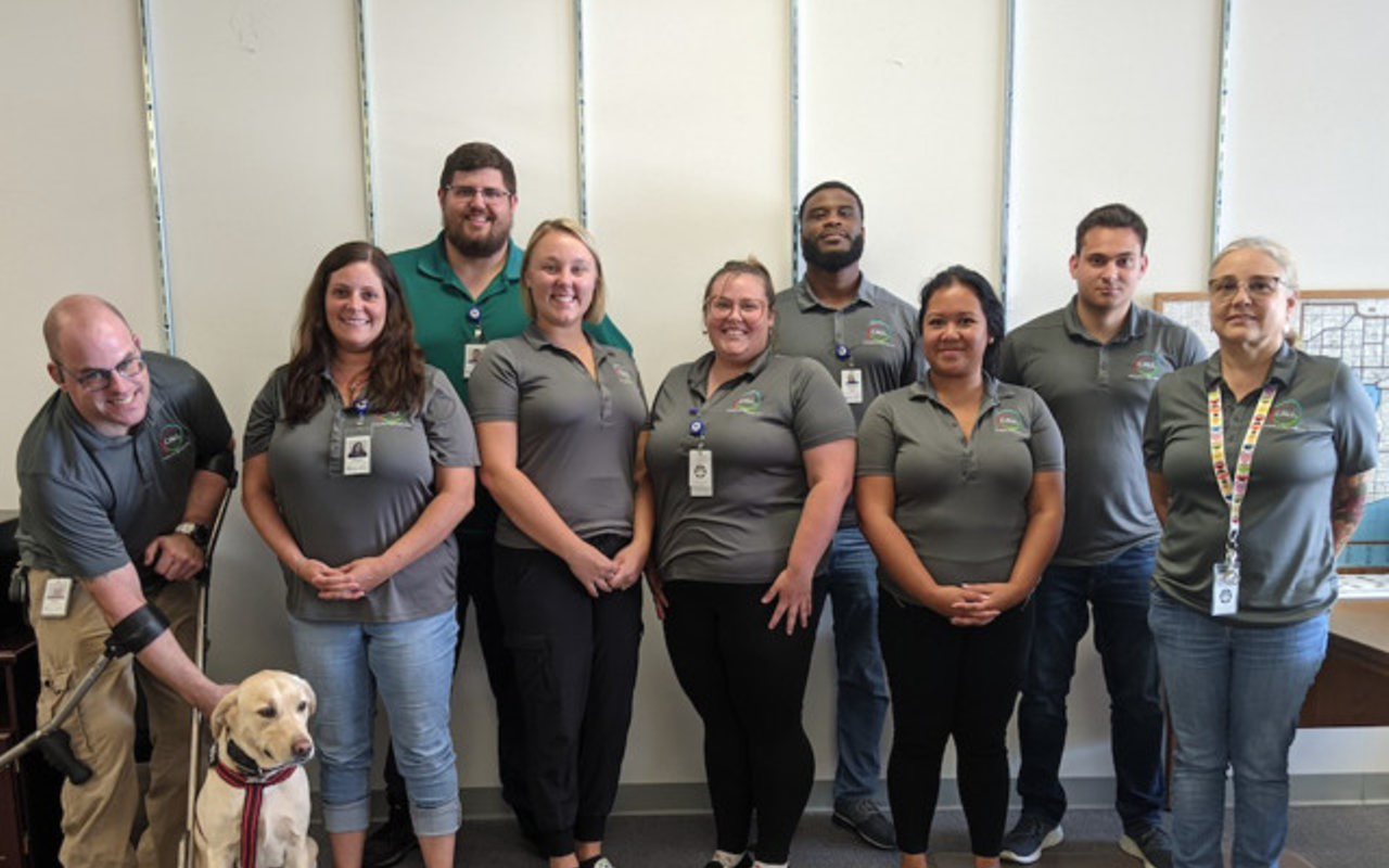 Ender the dog with nine of the 10-person team that makes up St. Petersburg, Florida's CALL team.