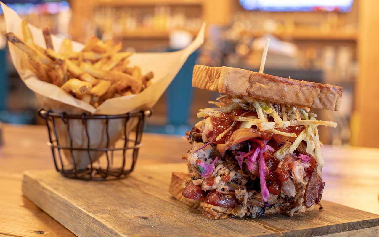 Dr. BBQ's Stunt Pig, served with double-fried fries, is a sandwich of Dagwood proportions.