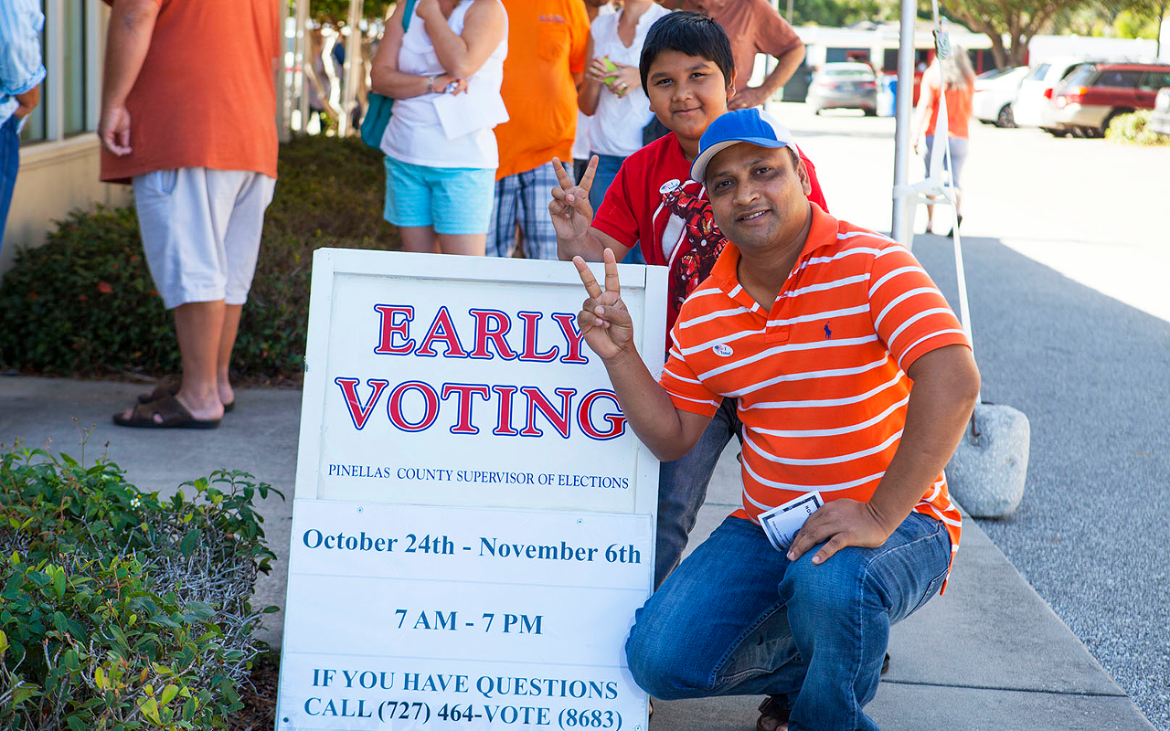 St. Pete's Mohammad Uddin and his son Sadman Sakin Uddin, 10, were posing for their cousin after voting at the Gulfport Community Center. It was the second time Uddin has voted.
