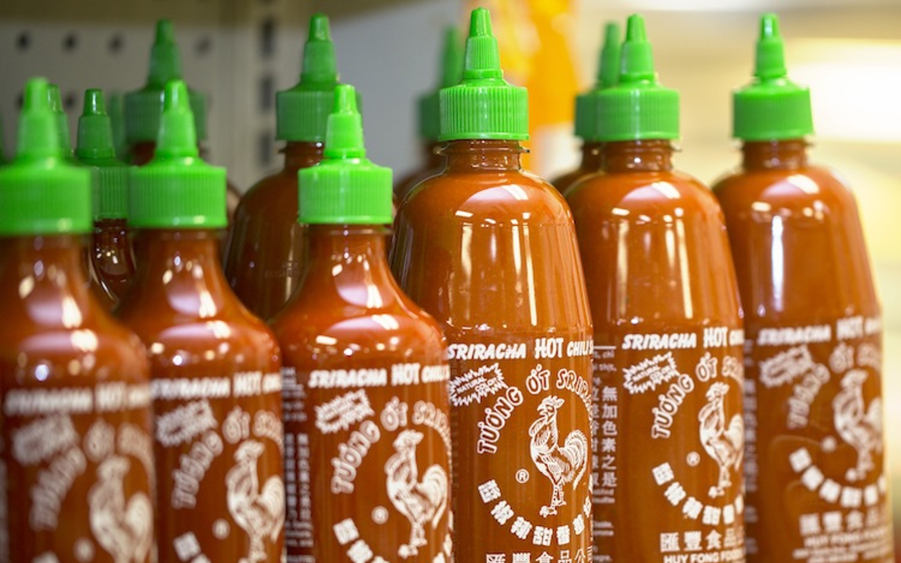 POPPYCOCK: At Tampa’s Oceanic Asian Supermarket, locals stocked up on Huy Fong Foods’ Sriracha rooster sauce last week.