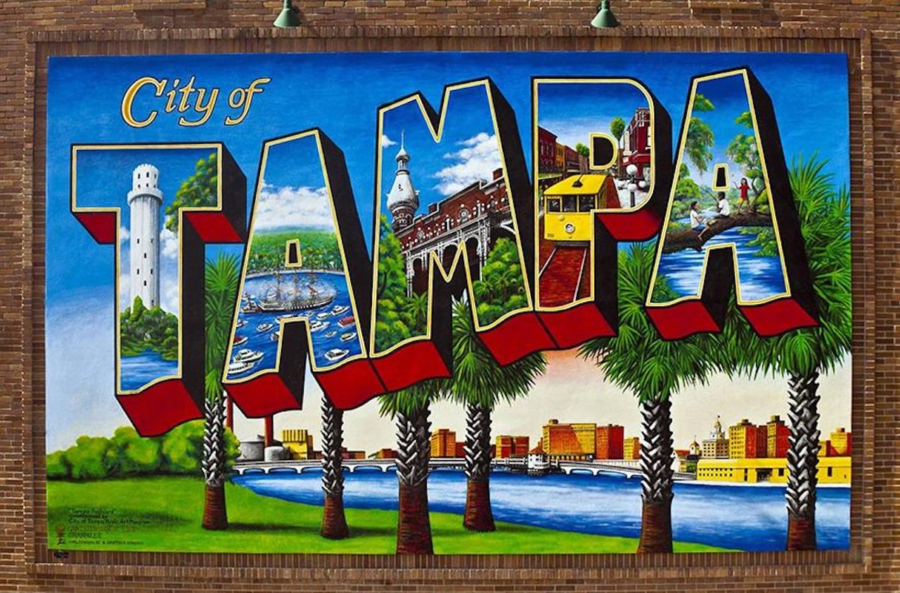 Carl Cowden III’s Tampa Postcard mural welcomes visitors to the City of Tampa
1102 N Florida Ave., Tampa
There’s nothing particularly original about a postcard mural, but they’re fun, and that’s probably why the Tampa Bay area has so many of them. In case you ever forget, Cowden’s mural is there to remind you when you are in the City of Tampa. Not surprisingly, the city commissioned this mural. Cowden coupled his experience in sign painting with his love of art nouveau to create this beloved mural highlighting all the best things Tampa has to offer, from Gasparilla to natural beauty to historic streetcars and architecture.