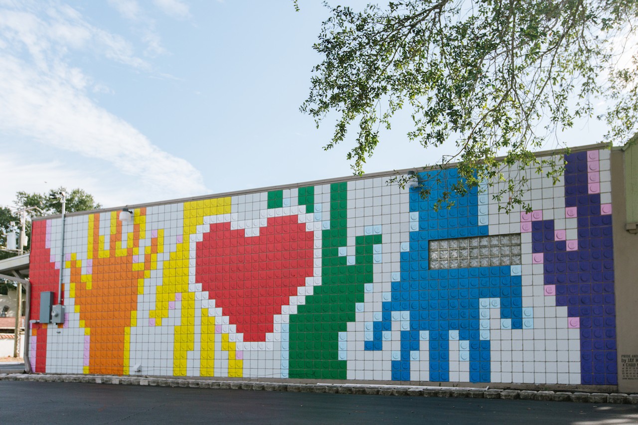 Jay Hoff and Chad Mize bring pride, love, and legos to St. Pete
2437 Central Ave., St. Petersburg
St. Petersburg artist Jay Hoff is known for making fine art from legos. In 2019, he created his first mural with Chad Mize and area LGBT youth. The Lego-inspired wall features a big red heart surrounded by hands in every color of the Pride flag. Pride and murals are a big part of what makes St. Pete great, and Hoff’s “Pride and Love” brings the two together in St. Pete’s Grand Central District.Photo via cityofstpete/Flickr