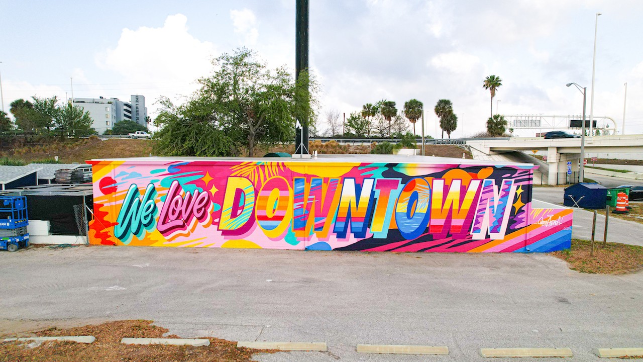 NYC graffiti legend Queen Andrea shares her love of downtown
1415 N Ashley Dr., Tampa
Tampa muralist Tony Krol invited NYC graffiti legend Queen Andrea to Tampa for the inaugural Tampa Walls in 2022, and she did not disappoint. The self-described letter queen lent her lettering talents to a wall just off I-275 in between Julian B. Lane Riverfront Park and Water Works Park. What once said nothing now says, “We love downtown.”Photo c/o Tony Krol