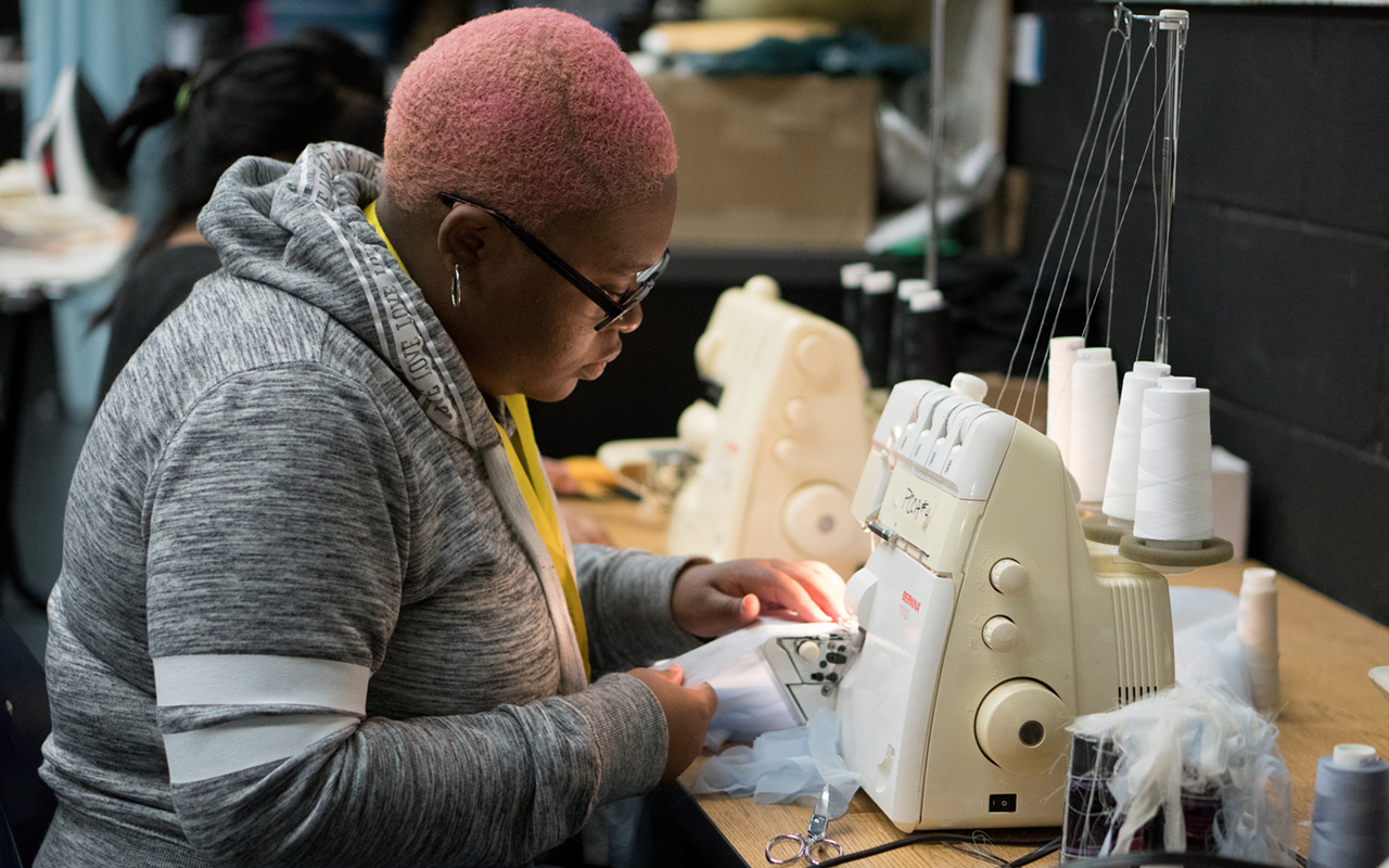 NEEDLE LITTLE FASHION?: Blake High student Kennysha Alleyne works on an overlock sewing machine, often called a Serger.