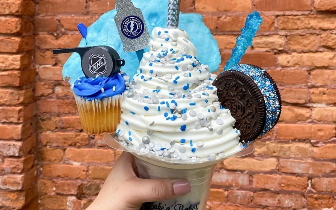 The NHL-themed vanilla ice cream is all about the blue; it’s got a vanilla cupcake topped with an NHL whistle, a Tampa Bay lightning silver glittering cup, blue cotton candy and an oreo ice cream sandwich dotted with blue sprinkles.