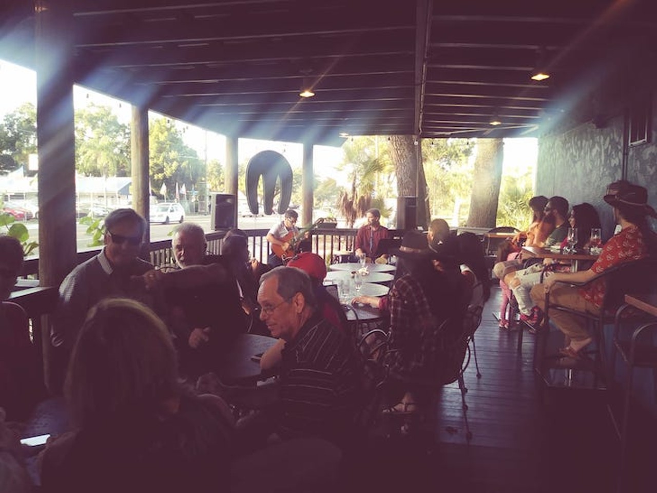 Mermaid Tavern  
6719 N Nebraska Ave., Tampa, 813-238-5618
Dim lighting for their few tables inside, but plenty of seating outside on picnic tables and on the patio. Order at the counter, and the server will find you when your food is ready. 
Photo via Mermaid Tavern/ Facebook 