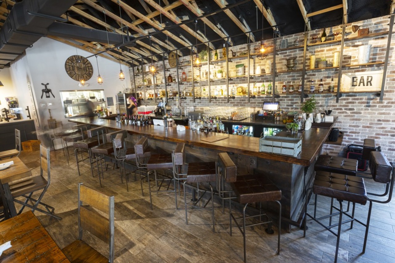 The C House  
6005 N. Florida Ave., Tampa, 813-488-4813
Built out of a former transmission repair shop in Seminole Heights,The C House has transformed the space into a casual-chic environment with a beamed ceiling, raw brick walls and caged pendant lights.
Photo via Chip Weiner