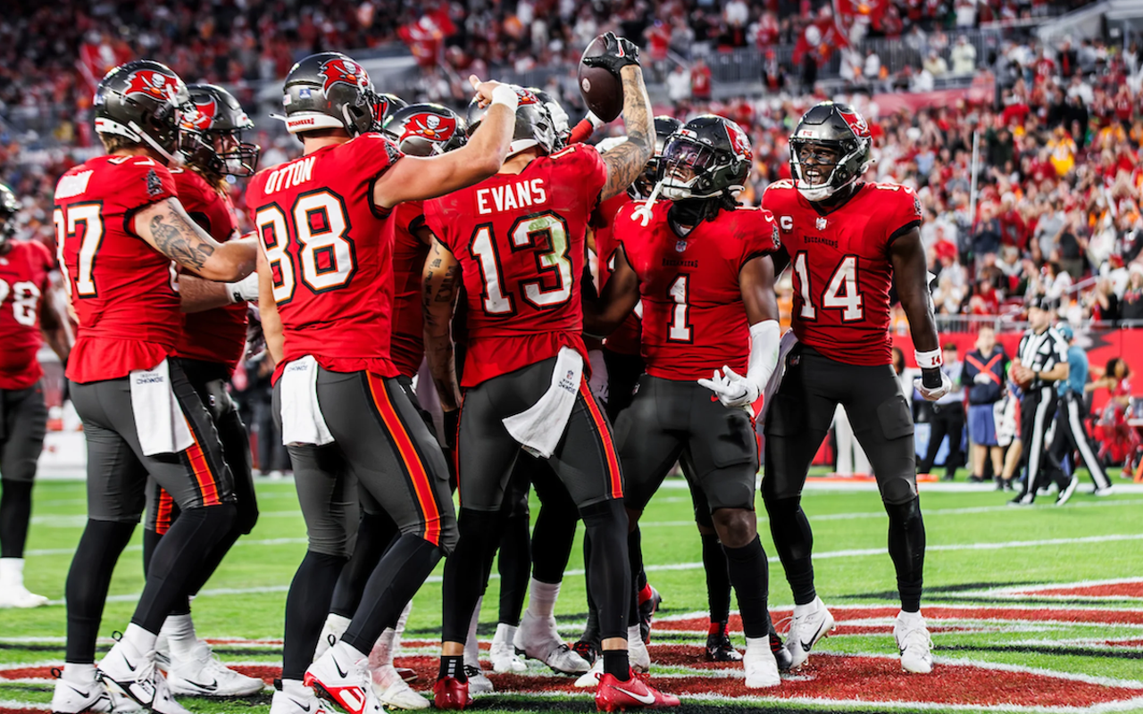 Tampa Bay Buccaneers wide receiver Mike Evans—pictured, center, on Dec. 24, 2023 at Raymond James Stadium in Tampa, Florida—hauled in a pair of touchdowns to make it 13 tuddys for the year.