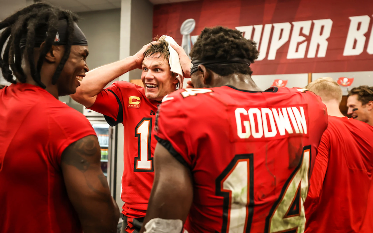 Tom Brady (center) with Julio Jones (L) and Chris Godwin (R) after the Tampa Bay Buccaneers beat the New Orleans Saints 17-16 at Raymond James Stadium in Tampa, Florida on Dec. 5, 2022.