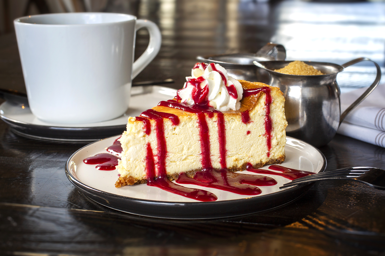 Four kinds of cheesecake are available for dessert, including one with a sweet berry coulis.