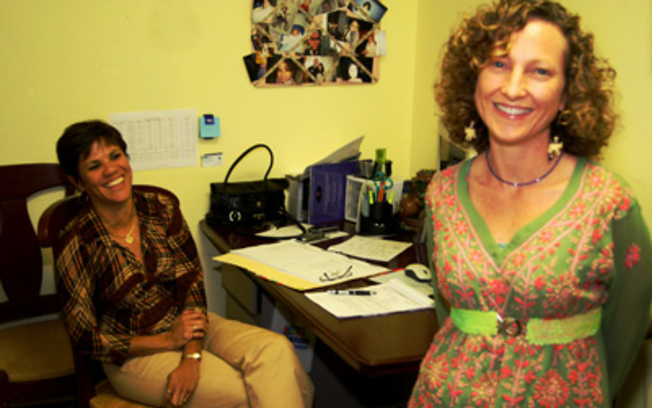 REACHING OUT: FICS' Executive Director Alayne Unterberger (right) and family counseler Angelica Socias.