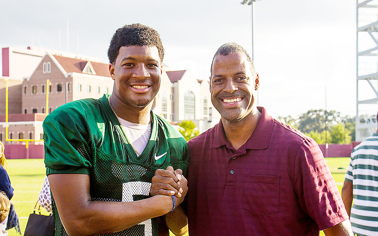 Florida State Seminoles quarterback Jameis Winston with a fan in Tallahassee in October of last year.