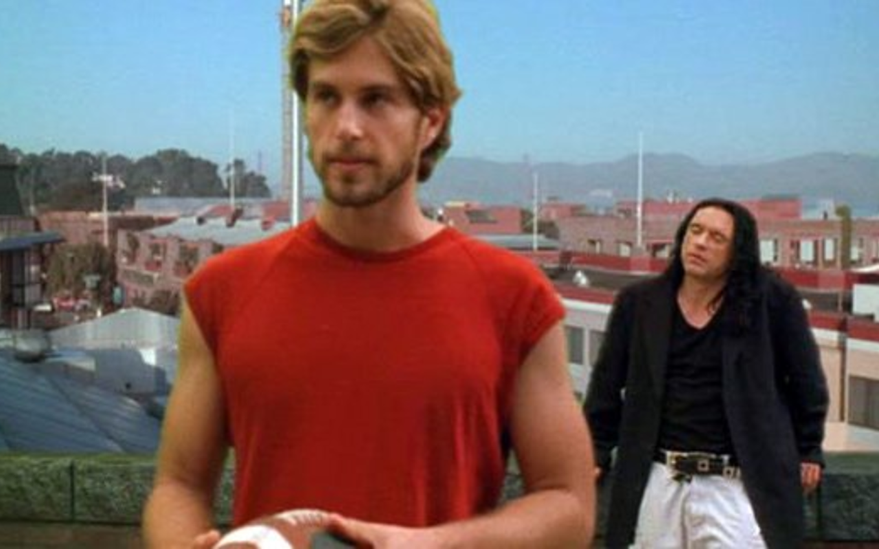Author Greg Sestero as Mark in The Room. Background — the immortal Tommy Wiseau.