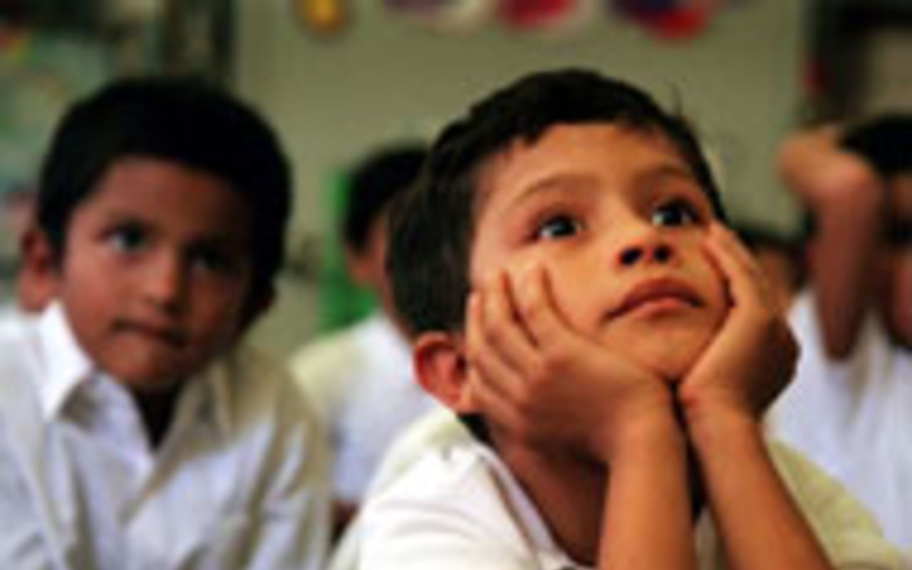 FUTURE INVESTMENT: At the San Jose Migrant 
    School in east Hillsborough County, parents are 
    enlisted as partners in their children's education. The 
    school also helps families with health and 
    social-services needs. Here, first grader Alberto 
    Castillo, 6, pays close attention during one of his 
    classes.