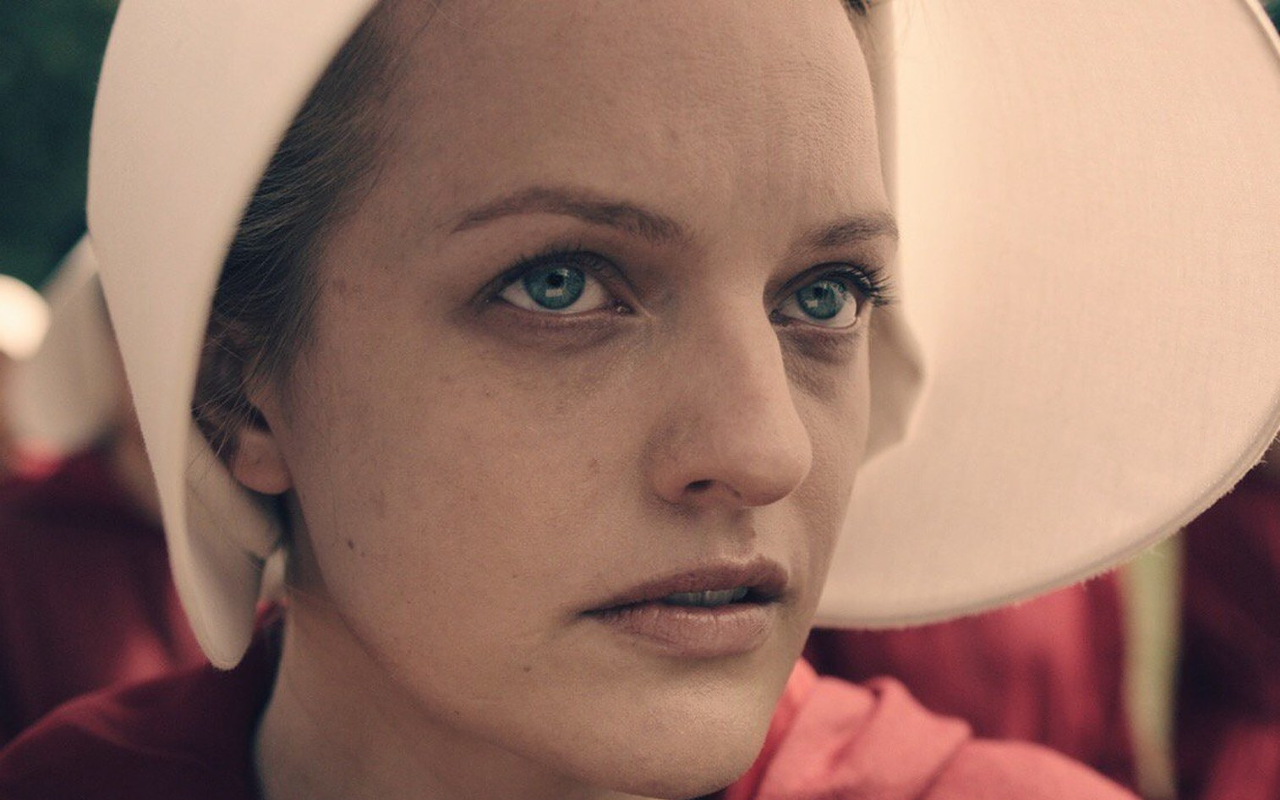 Elisabeth Moss plays the main character, Offred in Hulu's The Handmaid's Tale.