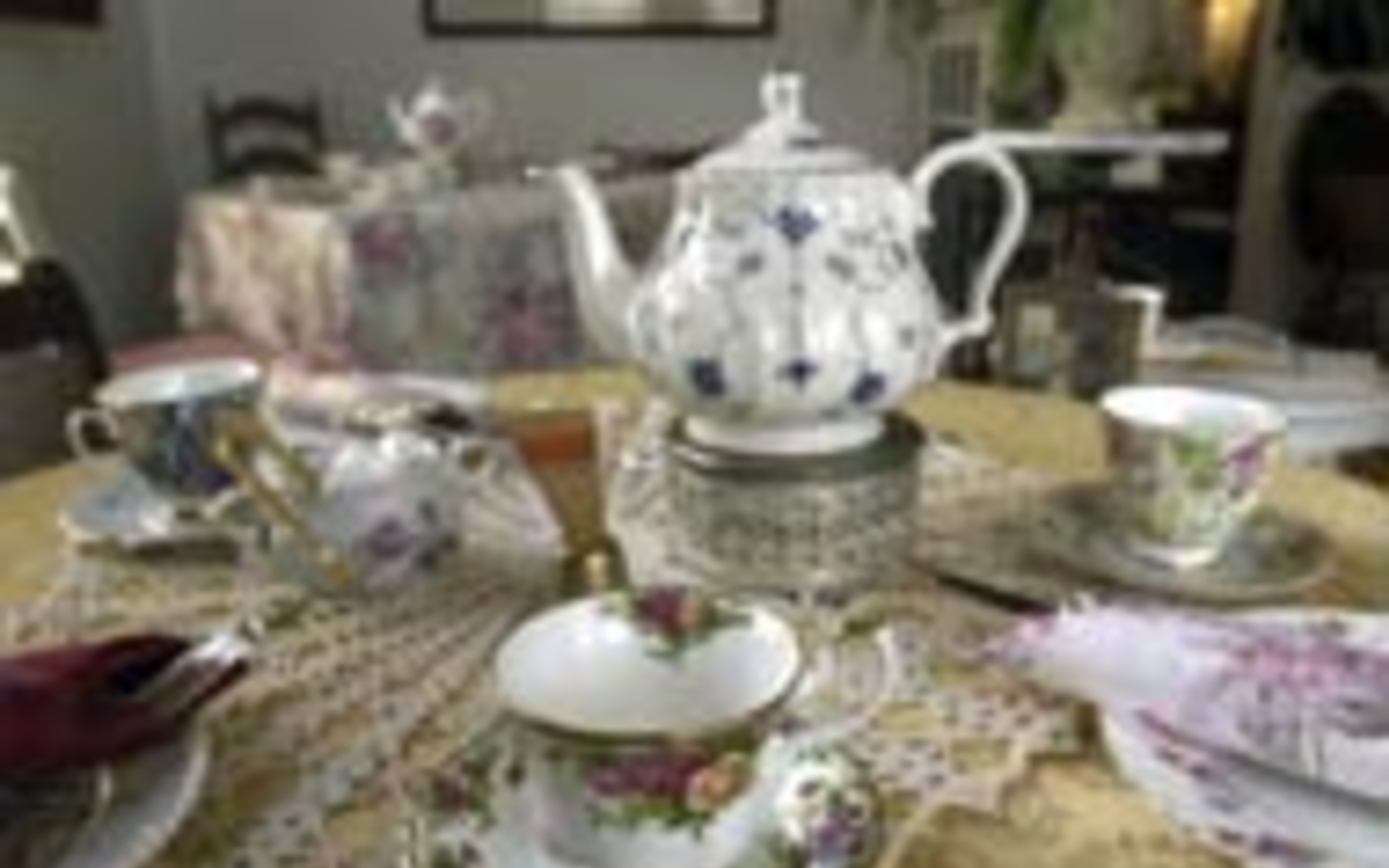 TEA PROPS: The delightfully mismatched assortment 
    of china adds to the ambiance at House of Two 
    Sisters.