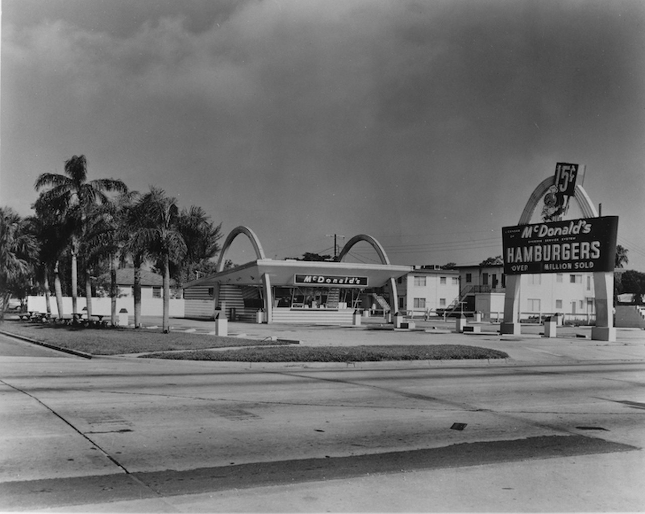 THEN
Mc Donald&#146;s 
3515 Dale Mabry Highway South, on the northwest corner of Dale Mabry Highway South and Kensington Street, 1962. 
Opened in 1958 as the first bay area McDonald&#146;s, this store was a staple for the H.B. Plant High School crowd and South Tampa residents for decades. The building was razed twice for new designs, but notice how they have attempted to keep the Florida feel with palm trees running along Kensington Avenue since the first build.
