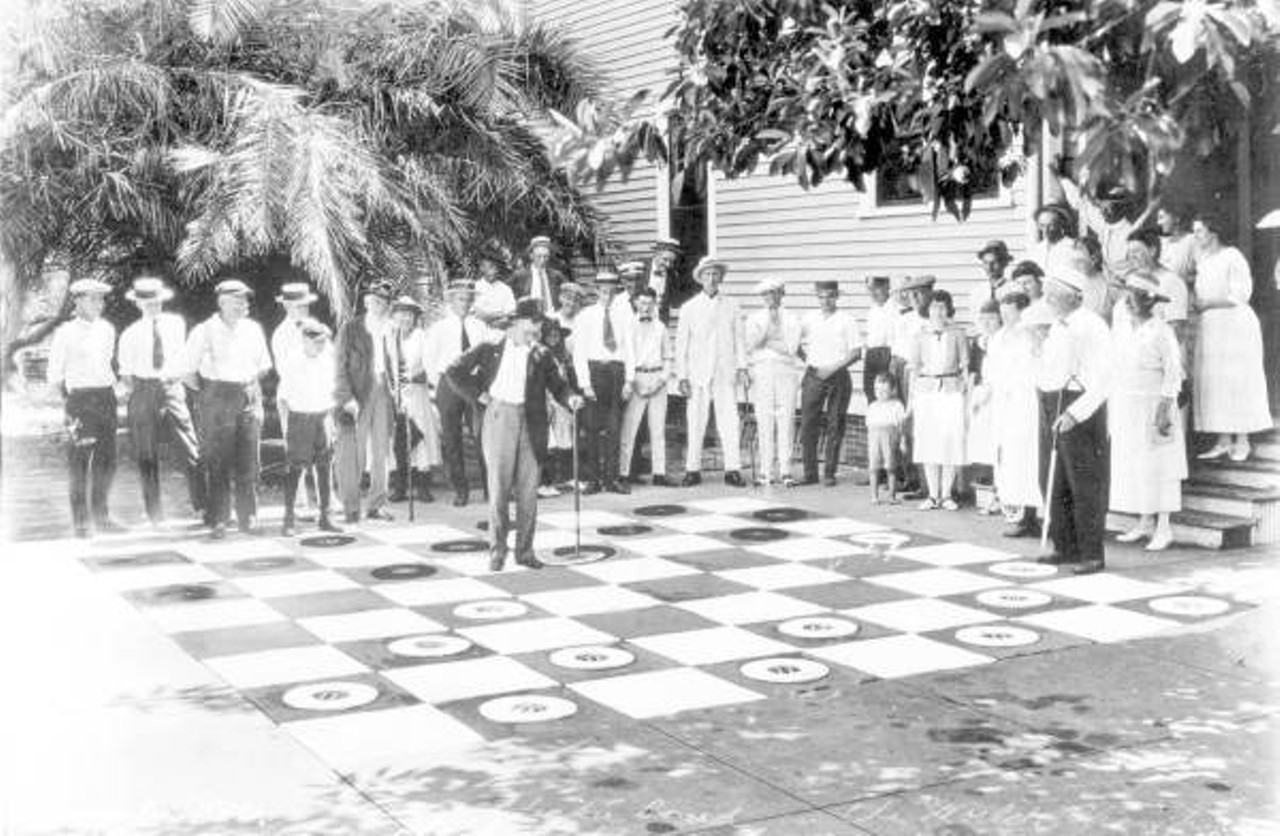 Men playing on the world's largest checker board - Clearwater, Florida. Photo taken sometime in the 1920s.
