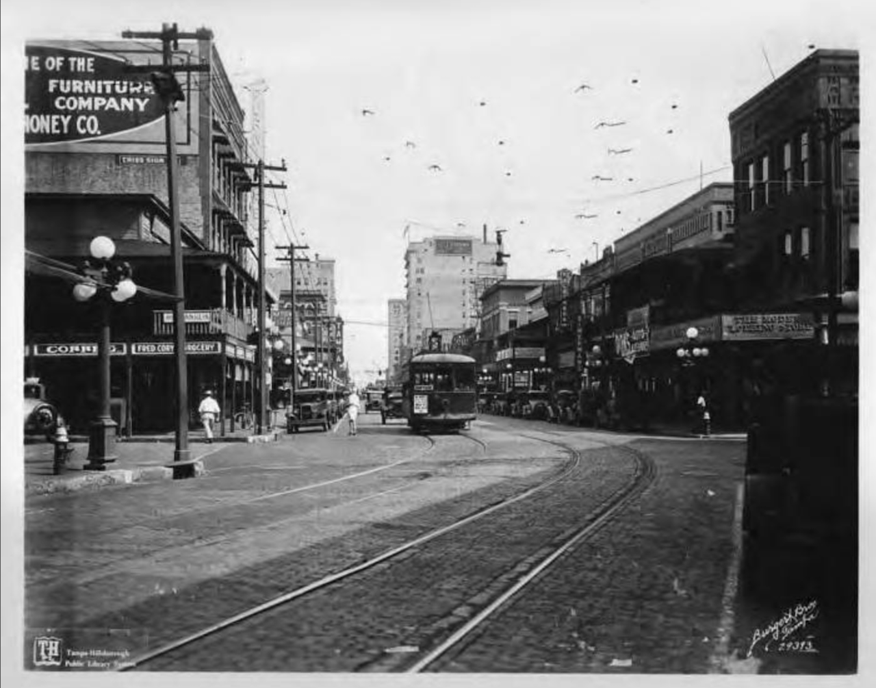 Franklin Street (1000 Block) facing south, with businesses, streetcar and traffic in Tampa, Florida in 1929.
Photo by Burgert Brothers via ia Tampa-Hillsborough County Public Library System