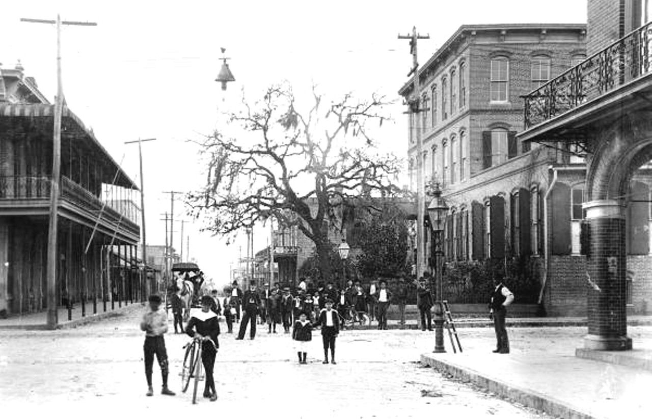 People stand on the intersection of 14th Street and 9th Avenue in Ybor City - Tampa, Florida. Date unknown.