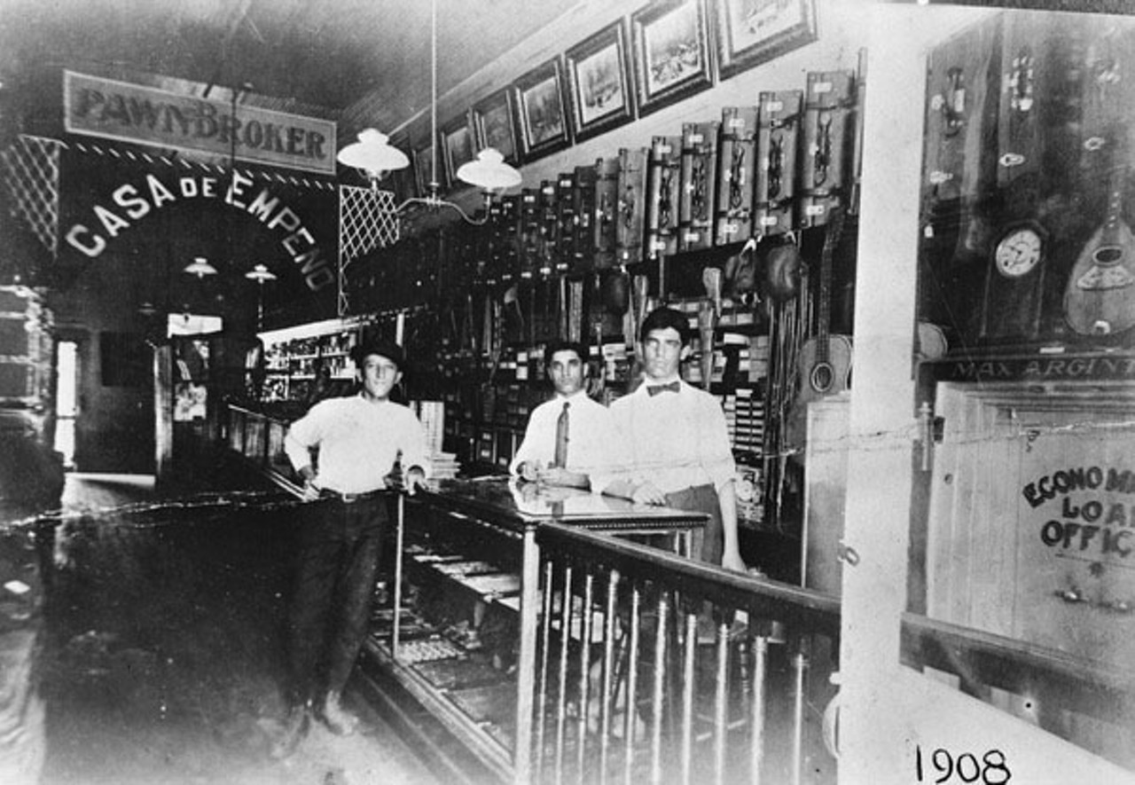 Max and Sender Argintar behind the counter at Max's store. 1908.