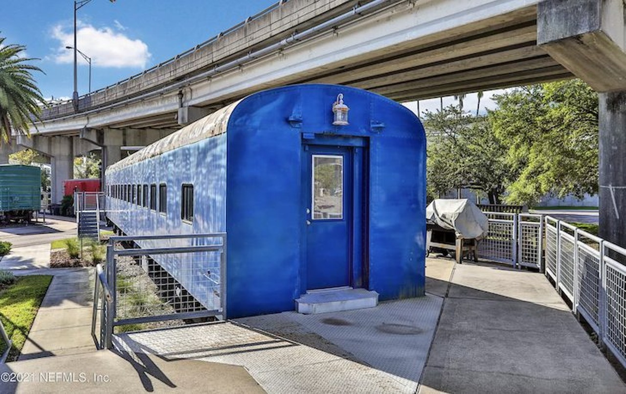This $305K train was converted into a home under a Florida overpass