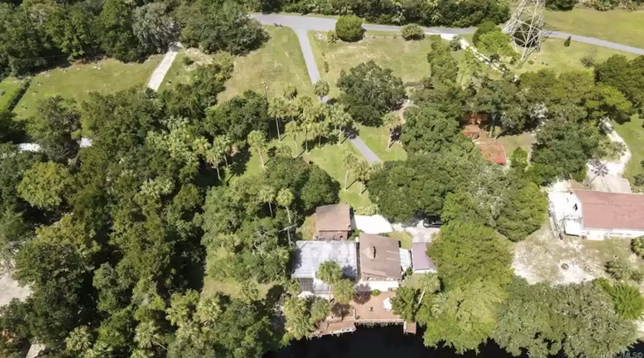 This Florida river house comes with an island, and a staircase built out of a tree