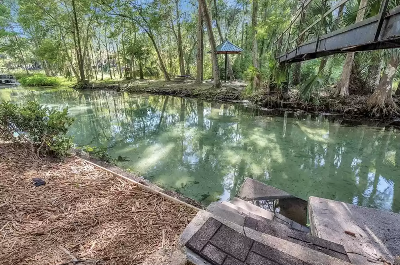 This Florida spring home on the Rainbow River comes with its own private island