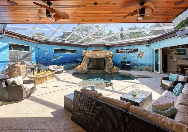This Sarasota house is built around a grotto, and comes with a tree house and a 'fish camp'