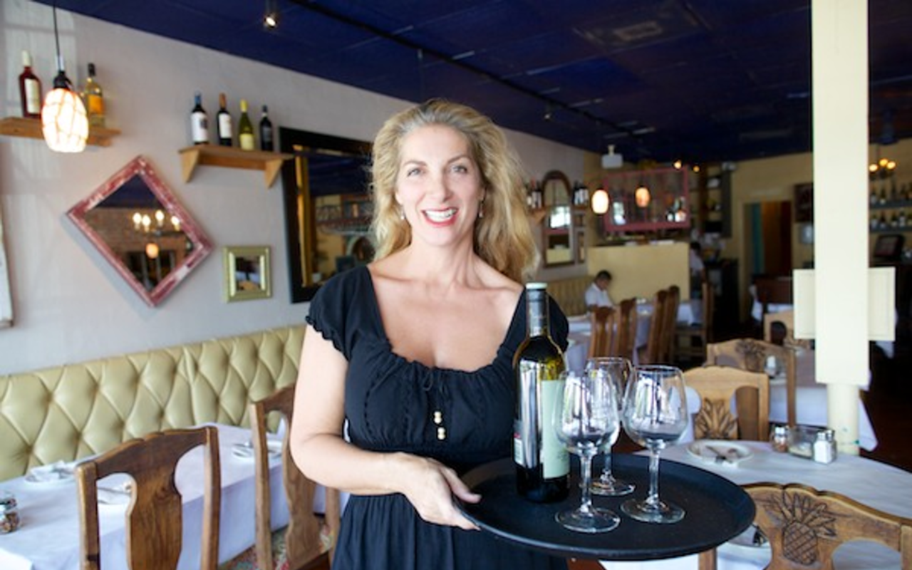 MOVER AND SHAKER: Tina Avila serving up some fine wines at Pan y Vino.