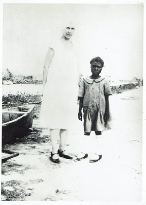 A handwritten note on the back of this photo reads, “Colored girl sole survivor of family of seven.” - Lawrence E. Will Museum of the Glades