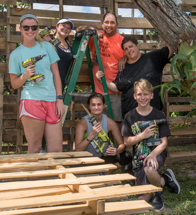 Kathleen Barbiere with family and friends, taken during the construction of this year's haunted maze. - Jennifer Ring