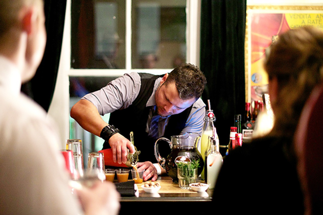 Andres Aleman mixes vintage cocktails at the Repeal Day Party in 2012. - Kevin Tighe