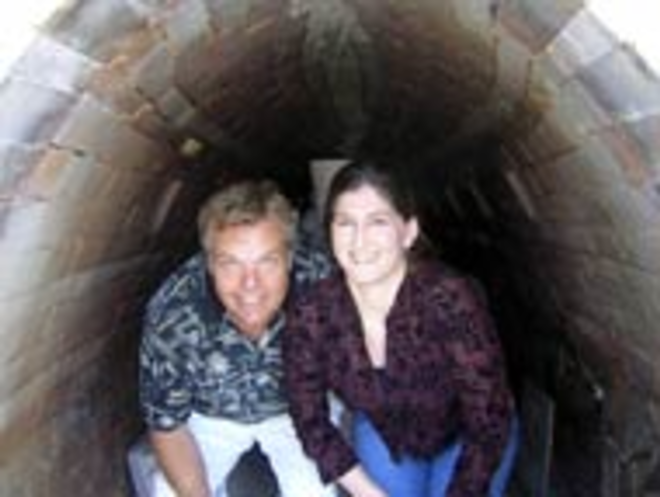 IT'S GETTING HOT IN HERE... Charlie Parker and Jennifer Lachtara stand inside the anagama kiln at St. Petersburg Clay Company. - Eric Snider