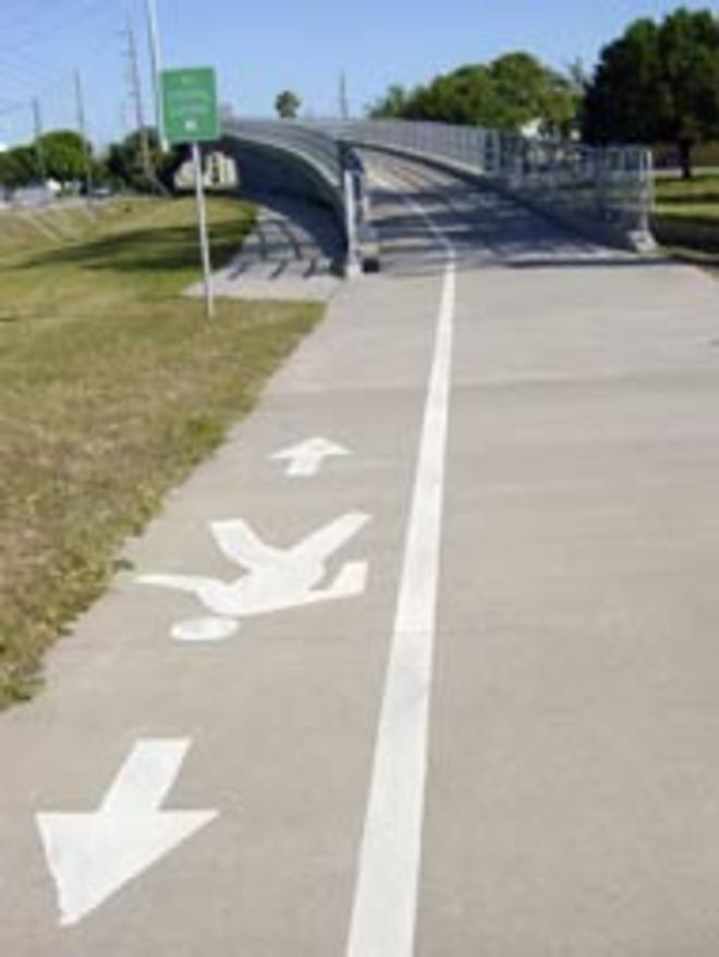 WALK THIS WAY: Signage on the Pinellas Trail points the way for pedestrians. - Max Linsky