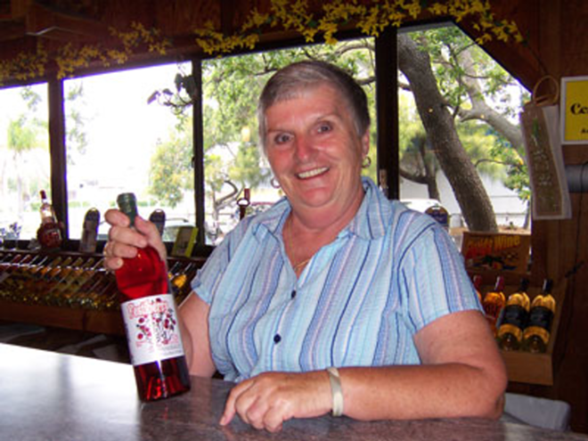 CHEERS! Cranberry wine and grandmotherly warmth from Nancy Gorman at Florida Orange Groves. - Taylor Eason