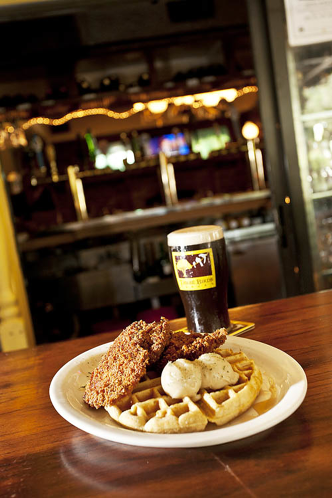 BUTTERING US UP: Chicken and waffles are enlivened by large scoops of maple butter. - James Ostrand
