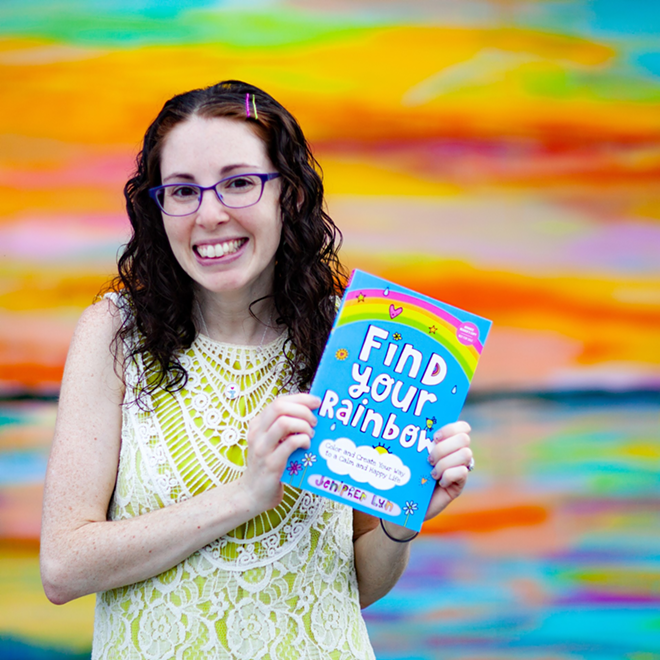 Jenipher Lyn poses with her new book, Find Your Rainbow. - Author photo
