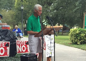 Former governor Charlie Crist, now a Congressional candidate, addresses the crowd. - Katherine Sinner