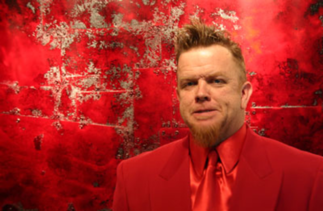 THE RED BARON: Strunk with his mixed-media work, "By Any Other Name." - Phil Bardi