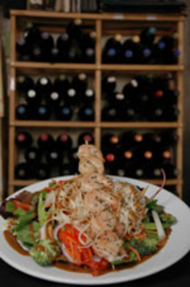 FOREIGN EXCHANGE: Dishes like the Thai noodle salad with seared shrimp often have an Asian tilt. - Lisa Mauriello