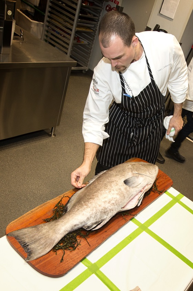 BACKSTAGE: Chef Matt Dahlkemper prepares black grouper for tableside presentation. - Chip Weiner