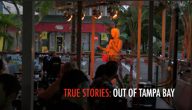 Lisa L. Kirchner calls another storyteller to the stage at True Stories. - Still from footage by Amy B. Nestor