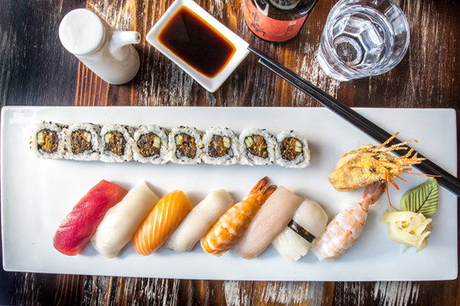The colorful nigiri platter, showcasing eight nigiri pieces and a spicy tuna roll. - Chip Weiner