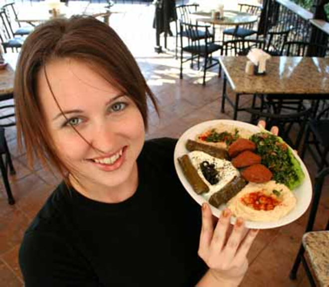DIVE IN: Server Stacey Palmer shows off Oasis Café's Vegetarian Mix Plate. - Eric Snider